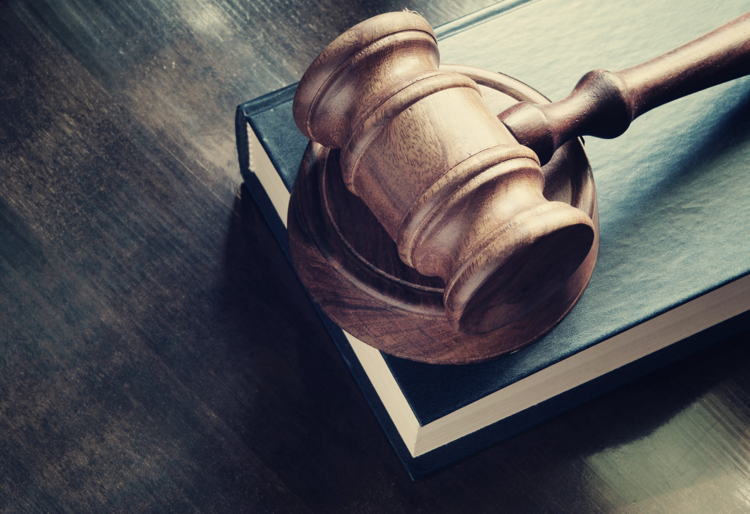 A gavel on a book